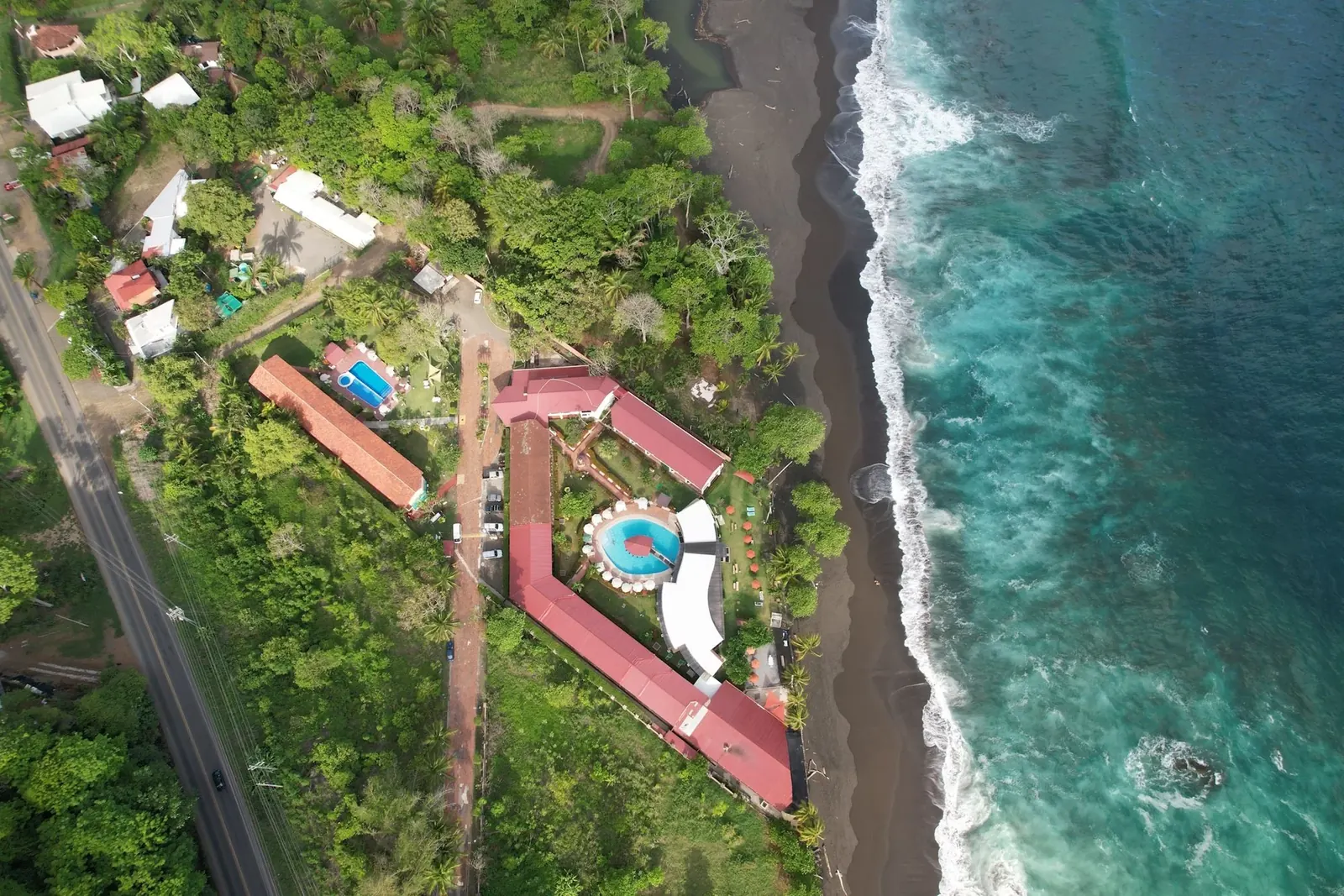 Aerial view of the Playa Hermosa coastline, jungle and surf