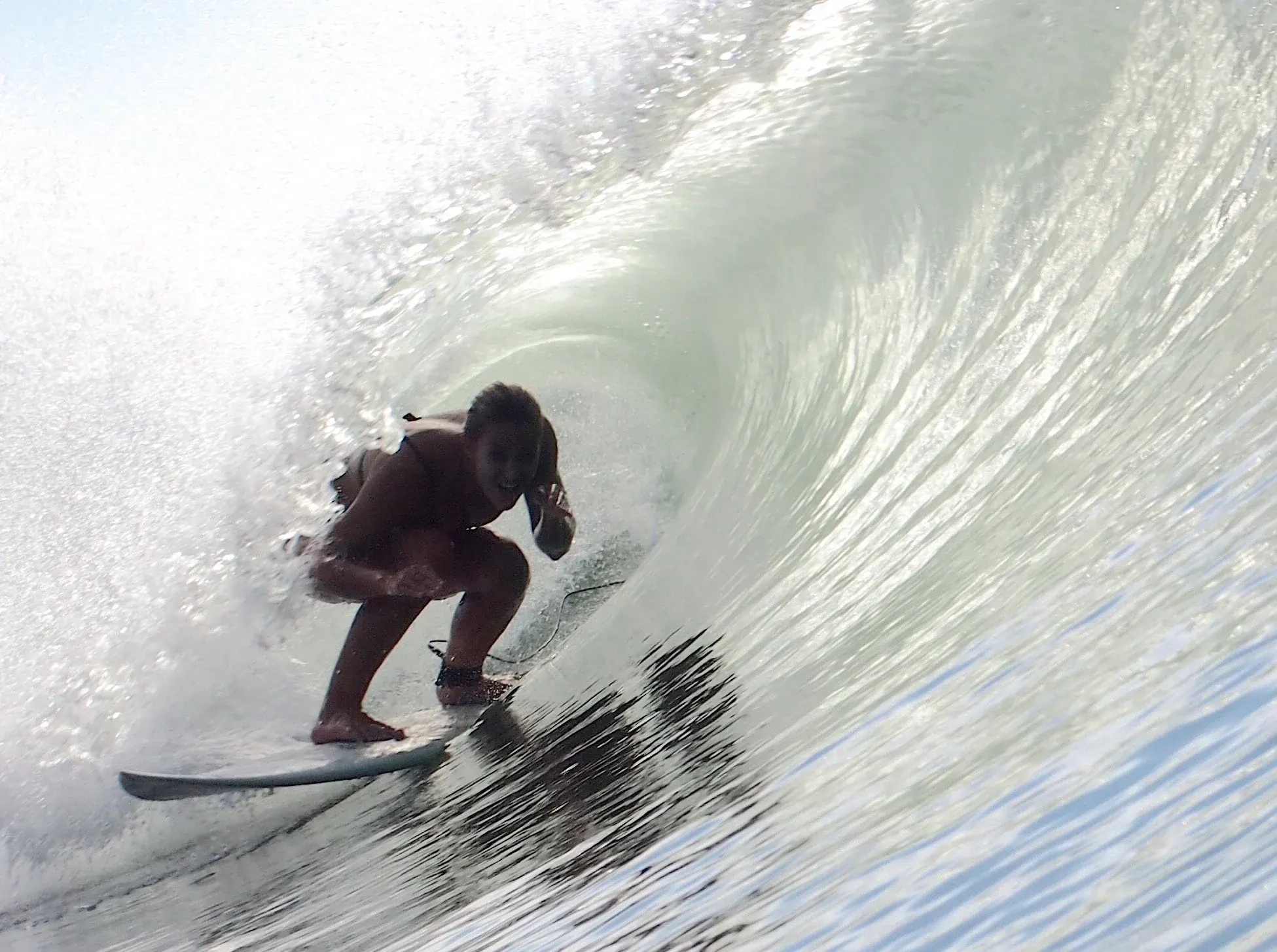 A surfer deep inside a barreling wave in Costa Rica