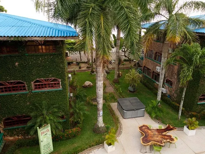 A villa with a hot tub in a landscaped courtyard